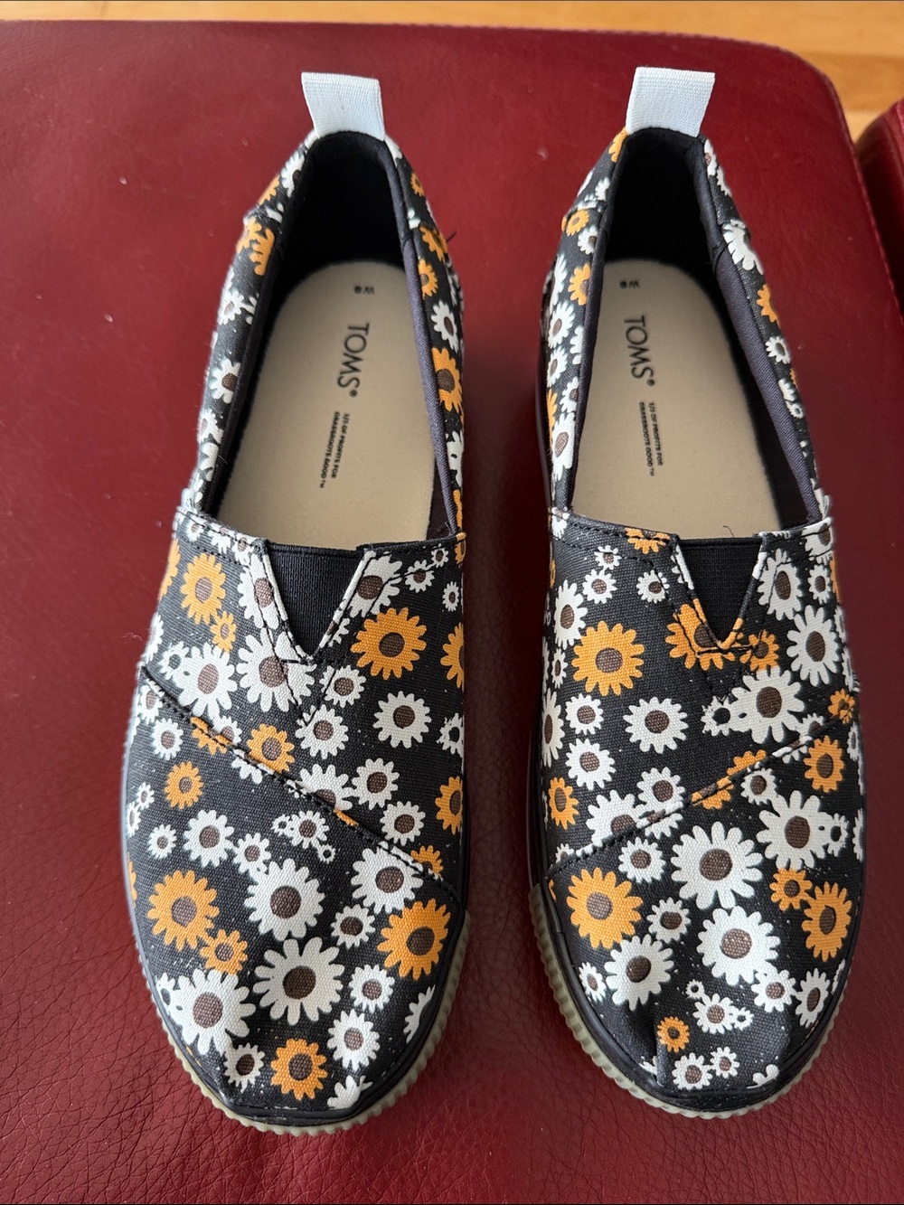 TOMS Black Slip-On Shoes with White & Yellow Daisy Print